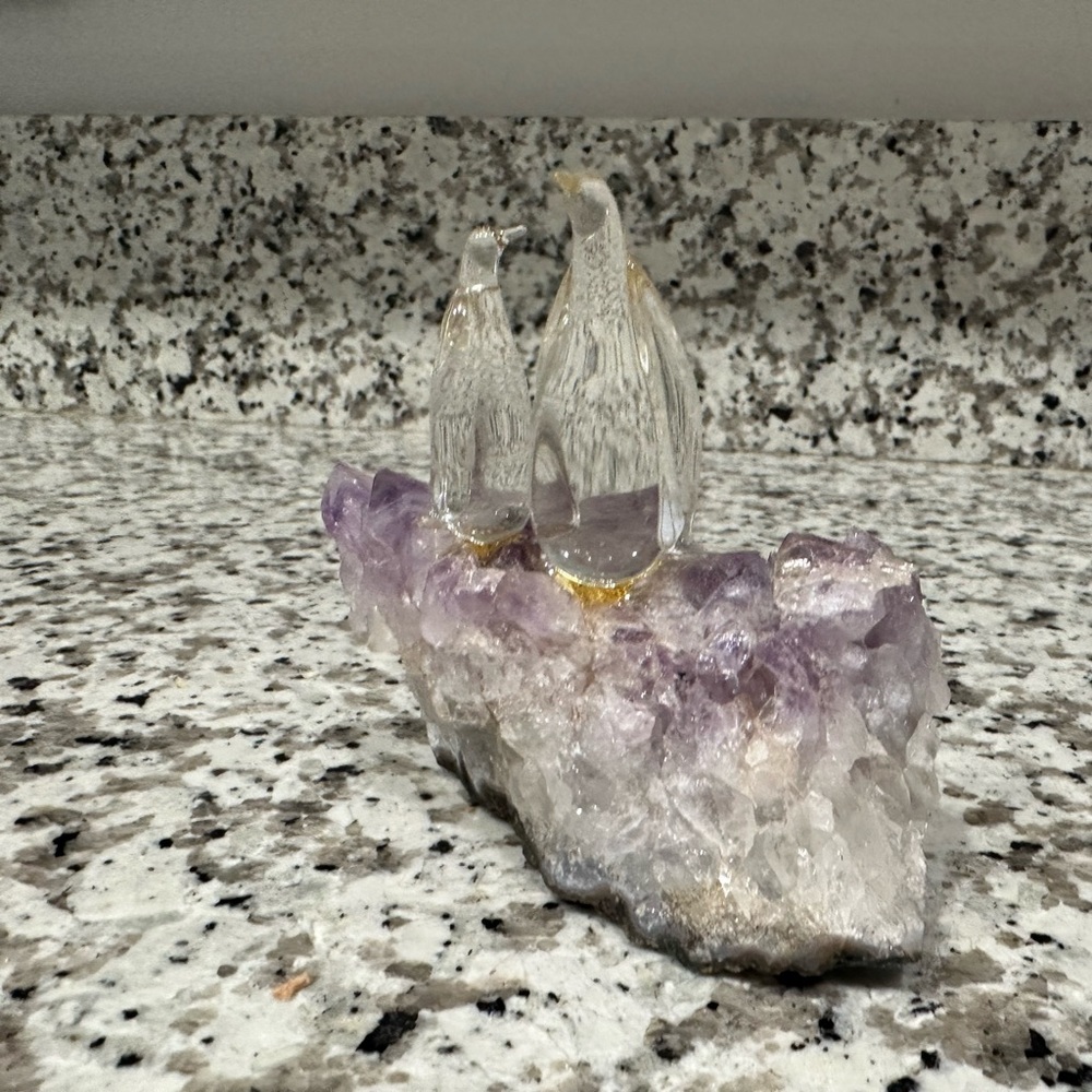 This is a couple penguin on Amethyst rock